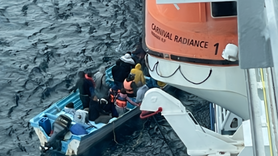 Carnival-Radiance-team-rescues-25-people-who-were-stranded-aboard-a-small-boat.jpg