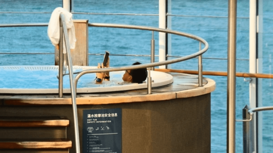 Man-Playing-on-Mobile-Phone-in-Cruise-Ship-Jacuzzi.png