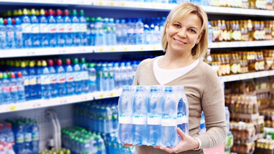 Woman-with-a-pack-of-water-bottle.jpg