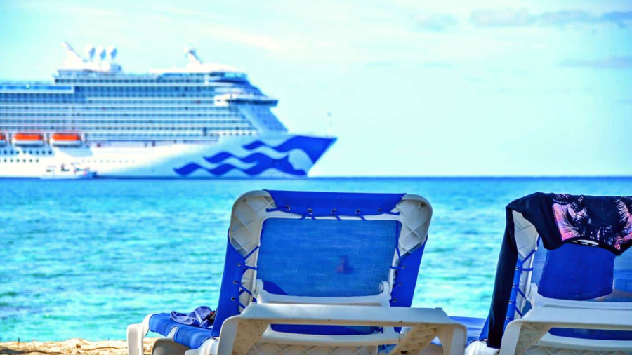 Princess-cruise-ship-off-coast-with-loungers-on-beach.jpg