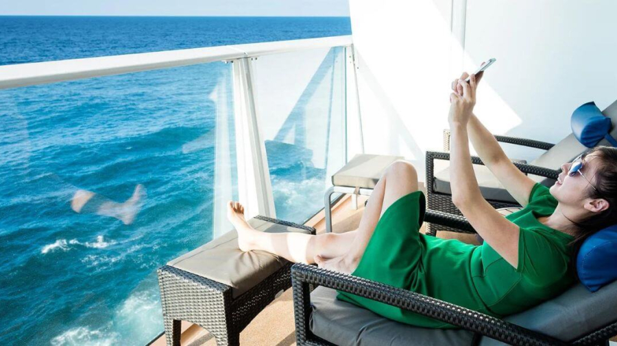 a-girl-using-phone-on-a-ship-1.jpg