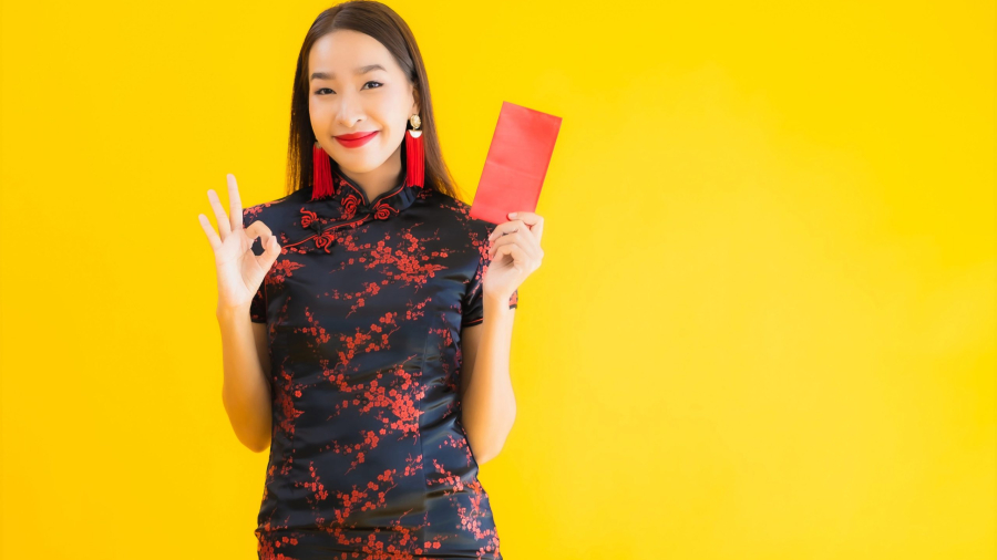portrait-beautiful-young-asian-woman-wear-chinese-dress-with-ang-pao-red-letter-with-cash-scaled.jpg