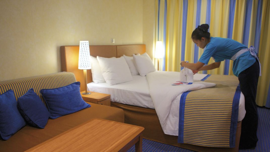 Carnival-stateroom-attendant-working-on-towel-animals.jpg