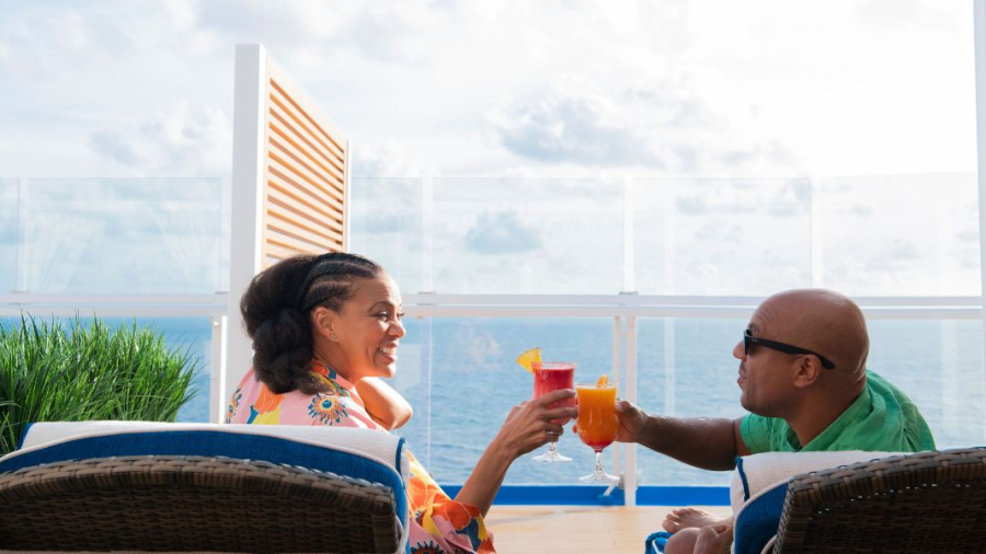 Couple-drinking-on-Mardi-Gras-deck.jpg
