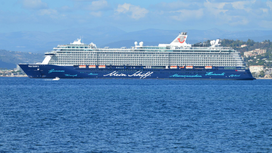 A large cruise ship sailing across open ocean waters