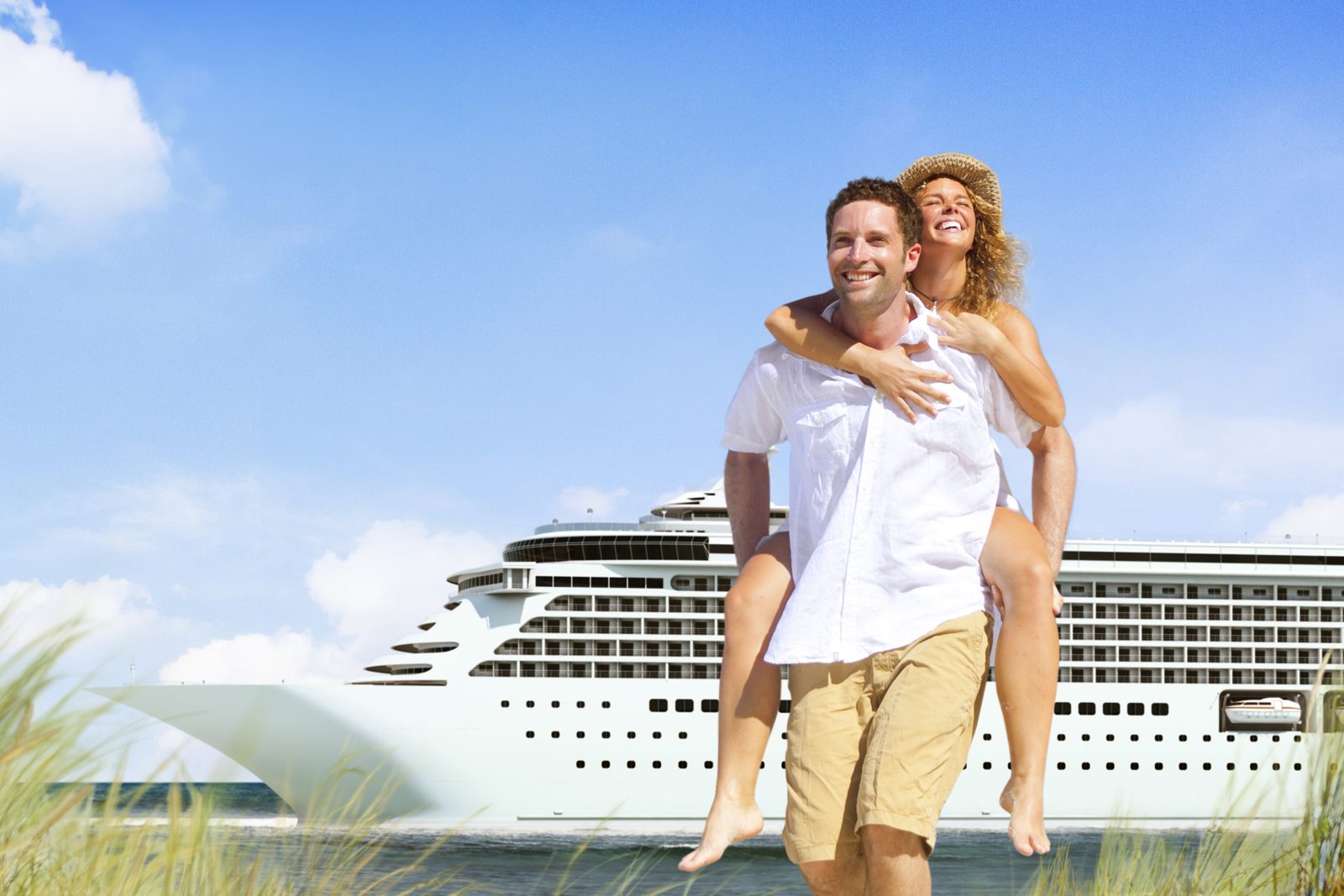 Couple enjoying a holiday in front of a large cruise ship
